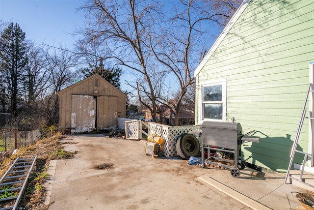 exterior space featuring a storage unit and grilling area