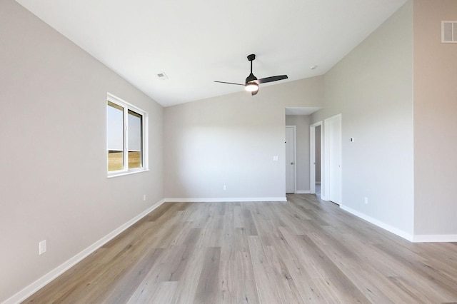 unfurnished room featuring light wood finished floors, baseboards, visible vents, and ceiling fan