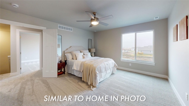 bedroom featuring ceiling fan and light carpet