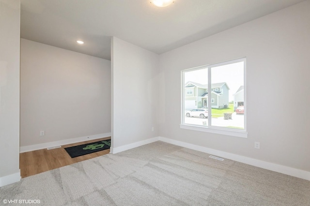 2231 Chan Dr, Adel, IA 50003 - spare room featuring carpet and recessed lighting
