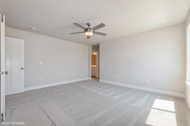 2231 Chan Dr, Adel, IA 50003 - spare room with ceiling fan, light carpet, and a smoke detector