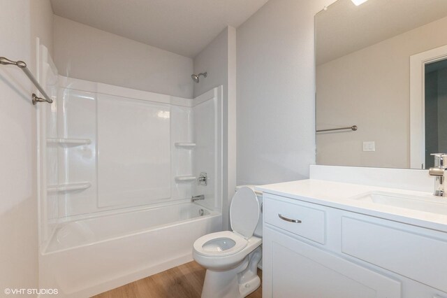 2231 Chan Dr, Adel, IA 50003 - full bath with vanity, wood finished floors, and washtub / shower combination