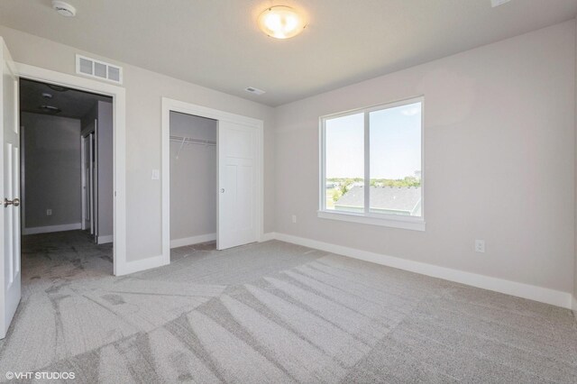 2231 Chan Dr, Adel, IA 50003 - unfurnished bedroom featuring light colored carpet and a closet