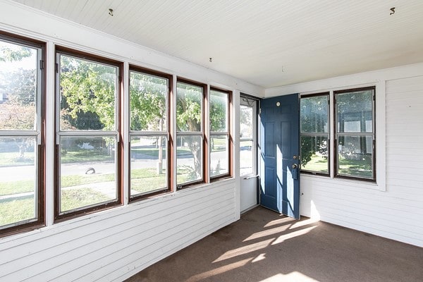 unfurnished sunroom with a wealth of natural light