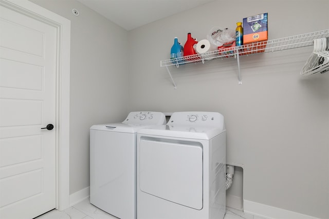 laundry area with washing machine and clothes dryer