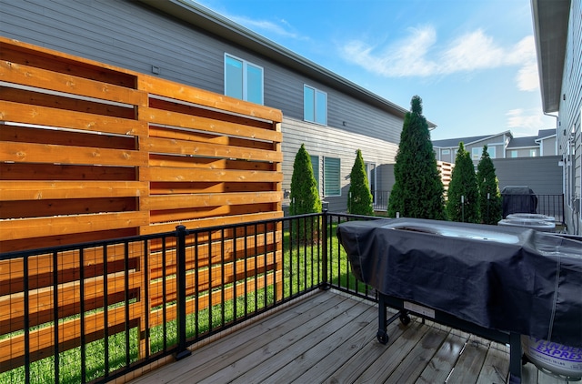 wooden terrace featuring grilling area