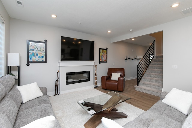 living room with light hardwood / wood-style flooring