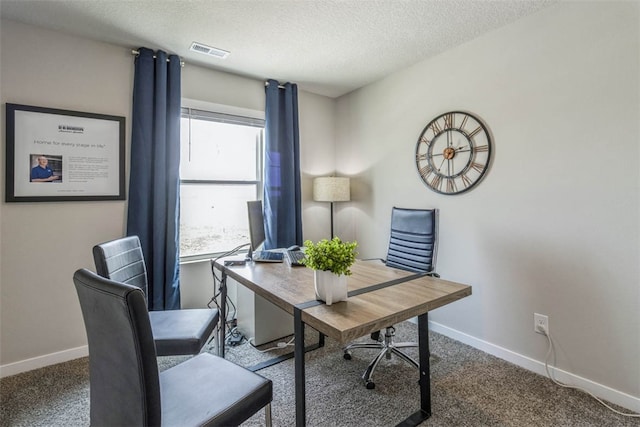 home office featuring carpet flooring and a textured ceiling