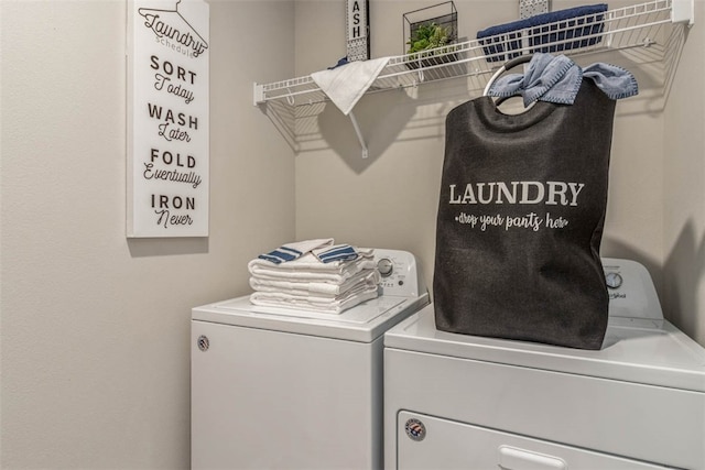 washroom with independent washer and dryer