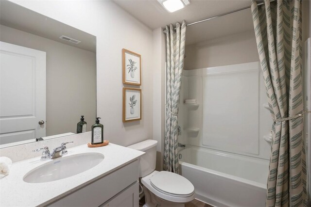 full bathroom with vanity, toilet, and shower / bath combination with curtain