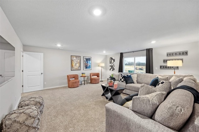 living area featuring a textured ceiling, baseboards, carpet flooring, and recessed lighting