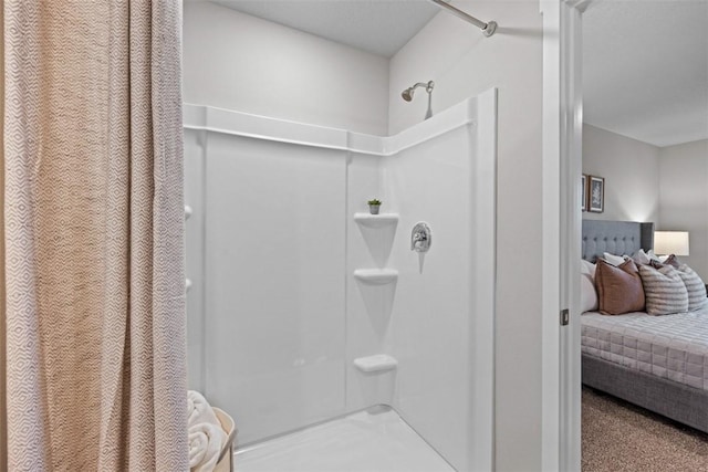 full bathroom featuring a shower with curtain and ensuite bathroom