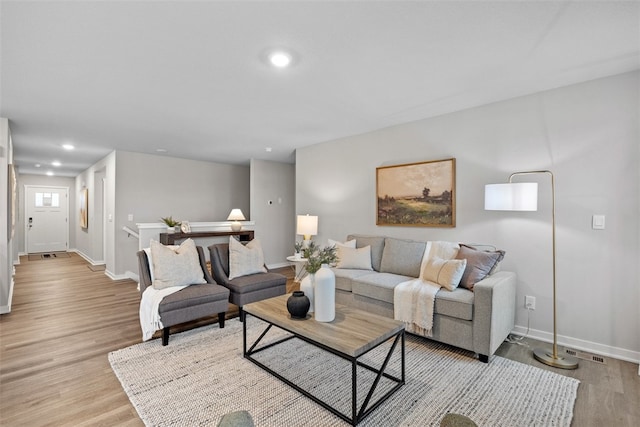 living room with light hardwood / wood-style floors