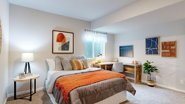 bedroom featuring carpet flooring, visible vents, and baseboards