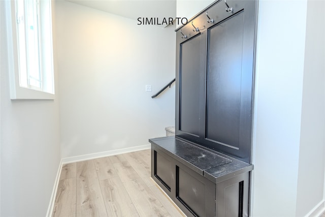 mudroom with light hardwood / wood-style floors