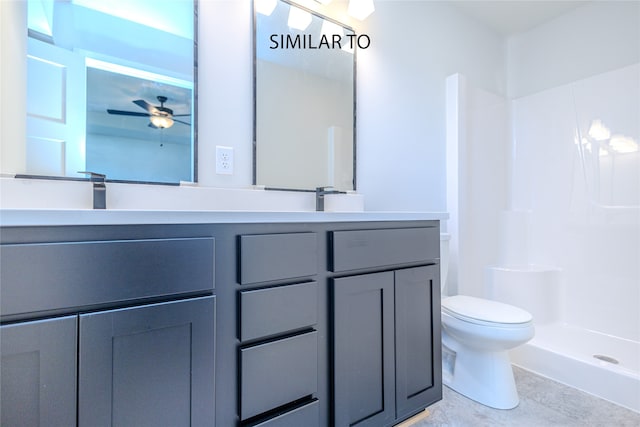 bathroom with ceiling fan, toilet, a shower, and vanity