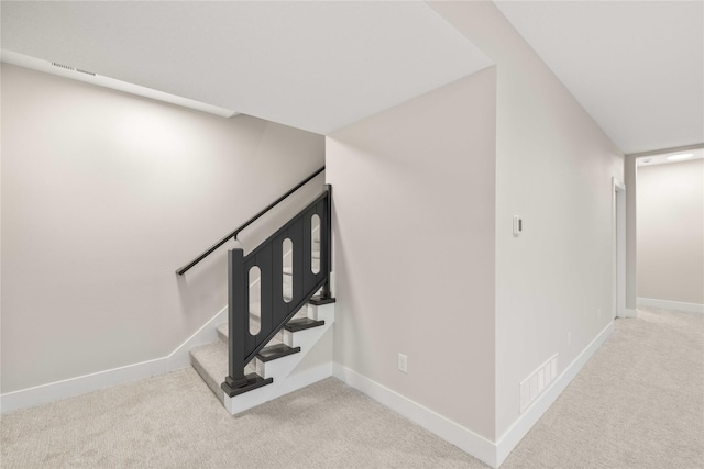 1129 NW 28th St, Grimes, IA 50111 - staircase with carpet floors and baseboards