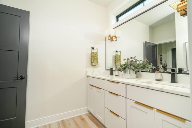 bathroom featuring vanity and wood-type flooring