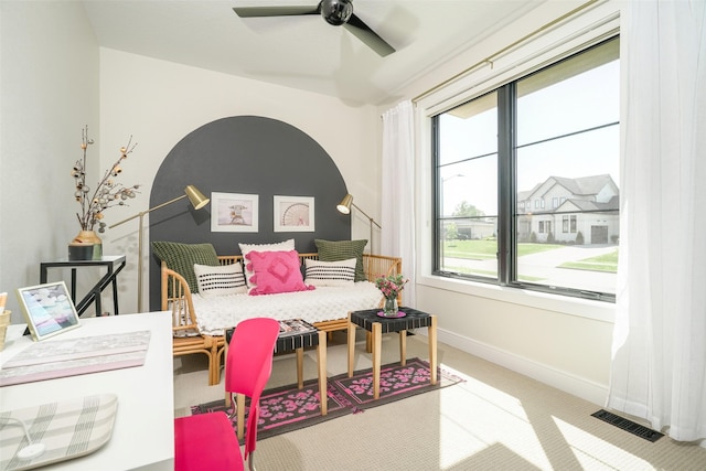 bedroom with light carpet and ceiling fan