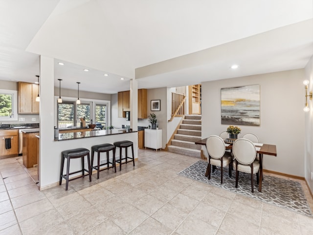 dining space featuring light tile patterned floors