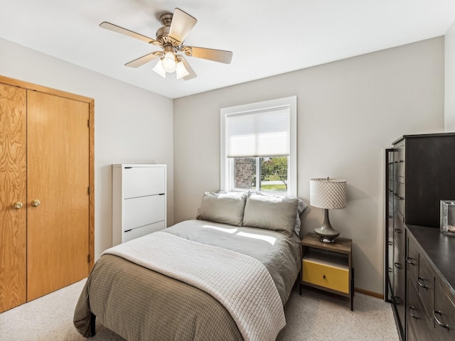 bedroom featuring ceiling fan and baseboards