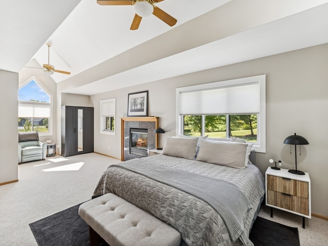 bedroom featuring light carpet, multiple windows, and ceiling fan