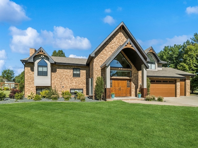 view of front of home featuring a front yard and a garage