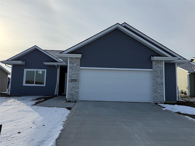 ranch-style home featuring a garage