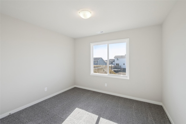 unfurnished room with carpet flooring