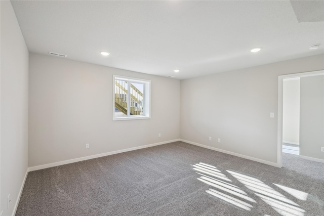 unfurnished room with carpet floors