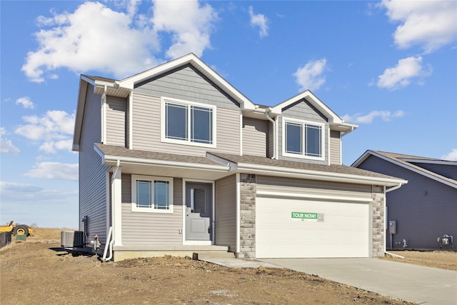 view of front of house with a garage and cooling unit