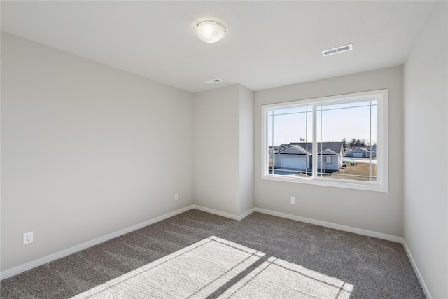 spare room featuring carpet flooring