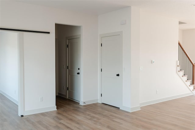 spare room featuring light hardwood / wood-style flooring