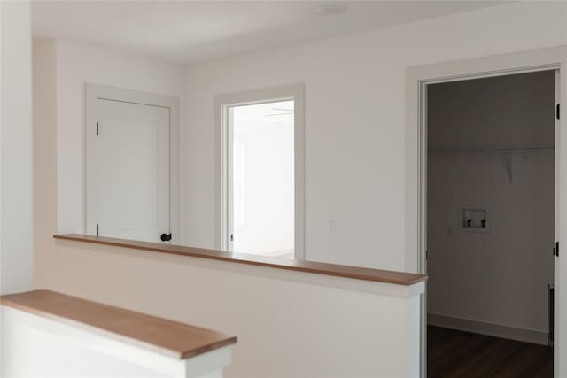 hallway with dark wood-type flooring