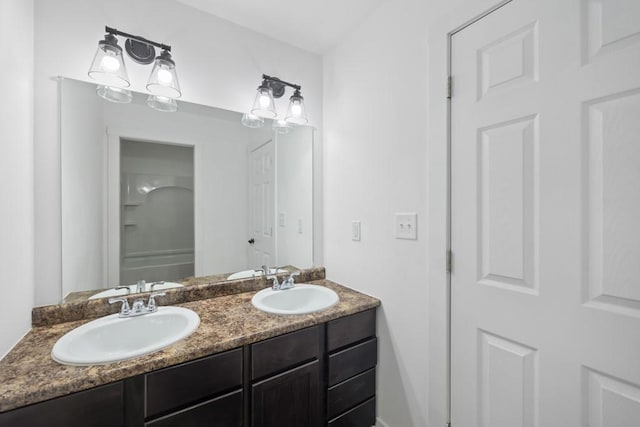 bathroom featuring double vanity and a sink