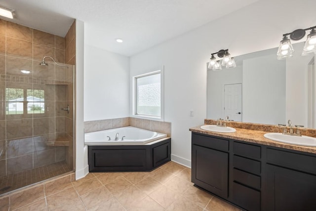 bathroom with double vanity, a bath, tiled shower, and a sink