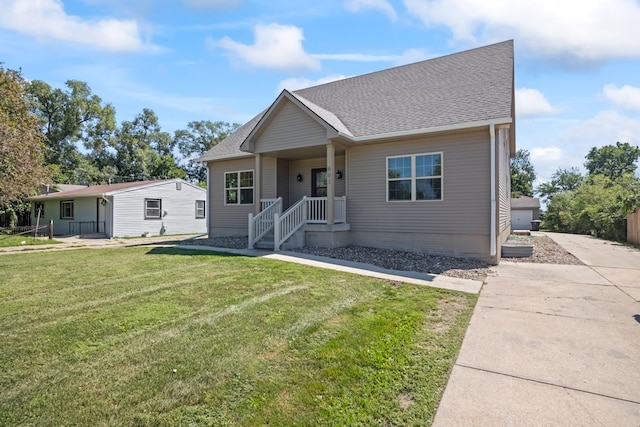 view of front of property with a porch and a front lawn