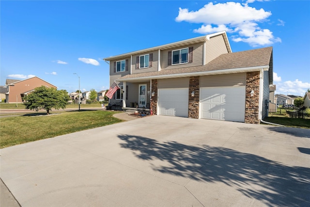 view of front facade with a garage and a front lawn