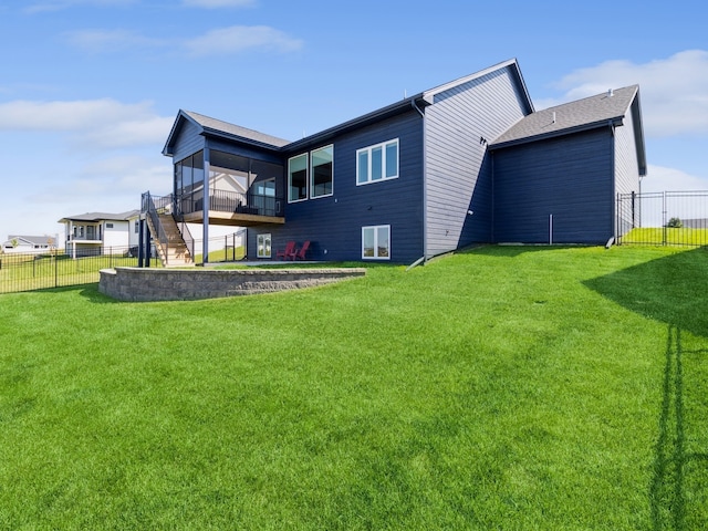 rear view of property featuring a yard and a patio