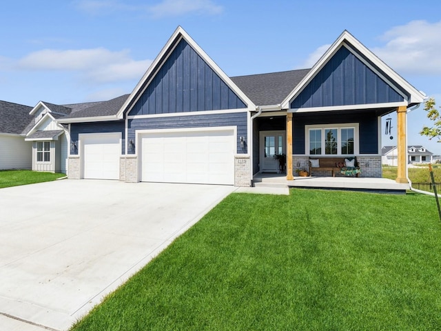 view of front of property featuring brick siding, a front lawn, board and batten siding, and an attached garage