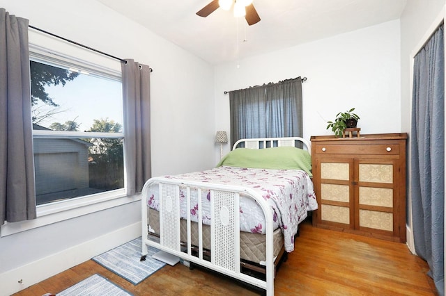 bedroom featuring ceiling fan and hardwood / wood-style flooring