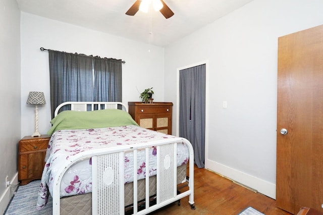 bedroom with hardwood / wood-style flooring and ceiling fan