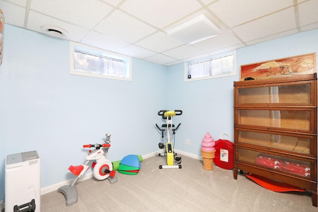 playroom featuring carpet flooring, plenty of natural light, and a paneled ceiling