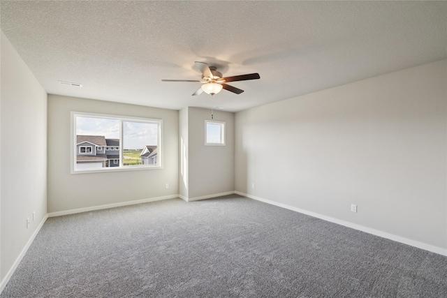 805 3rd St NW, Bondurant, IA 50035 - carpeted spare room with ceiling fan and a textured ceiling