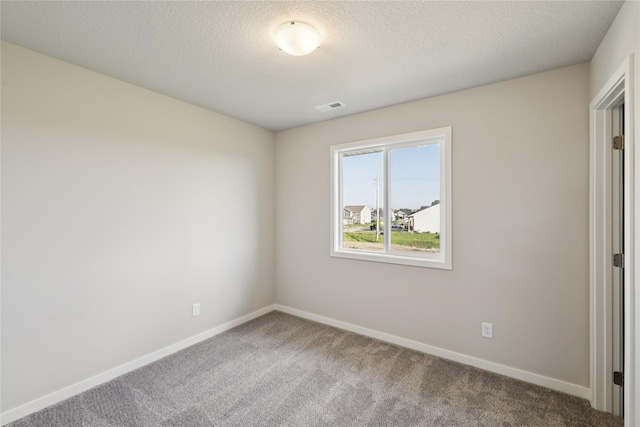 805 3rd St NW, Bondurant, IA 50035 - unfurnished bedroom featuring carpet floors and a textured ceiling