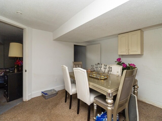 5820 Urbandale Ave, Des Moines, IA 50322 - carpeted dining area featuring a textured ceiling and baseboards