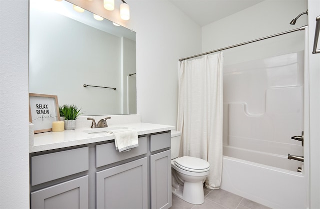 full bathroom with tile patterned floors, shower / bath combo, toilet, and vanity