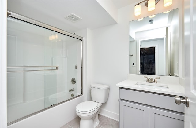 full bathroom with tile patterned flooring, vanity, toilet, and enclosed tub / shower combo