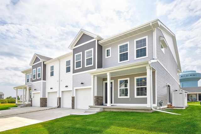 view of front of property featuring a garage and a front lawn