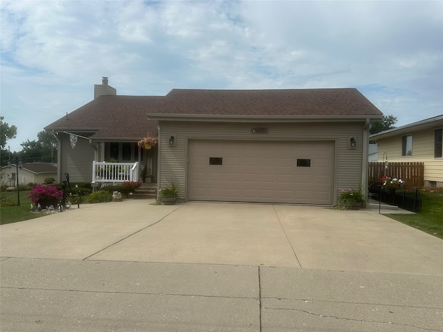 view of front facade with covered porch and a garage